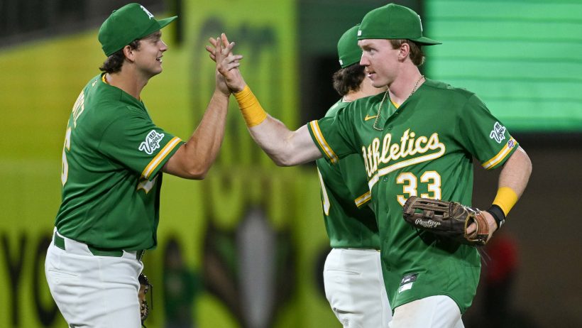 The Athletics celebrate a victory over the Cardinals.