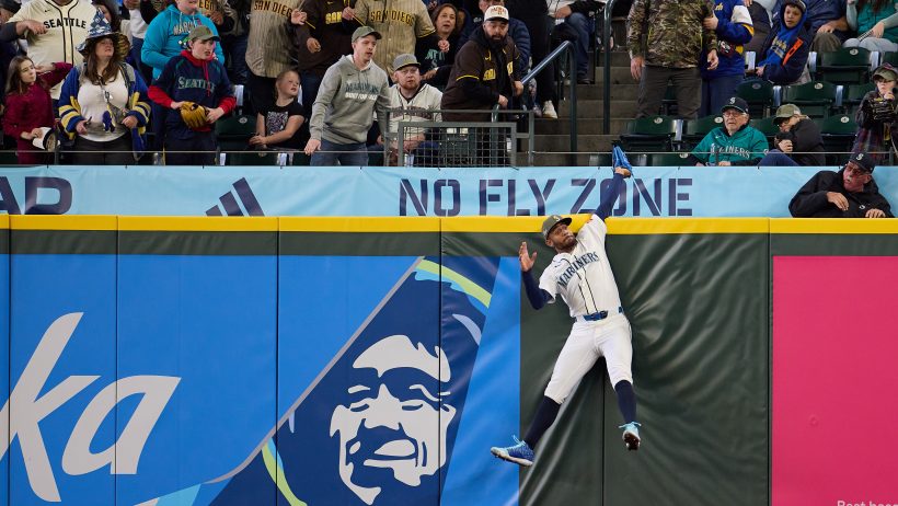 Seattle Mariners center fielder Julio Rodriguez makes a jumping catch at the wall
