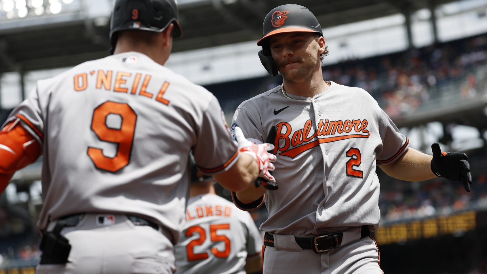 The Orioles celebrate a run versus the Nationals in an Interleague matchup.