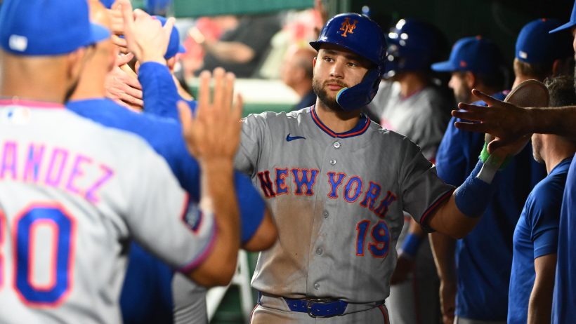 Bo Bichette gets congratulated in the dugout.