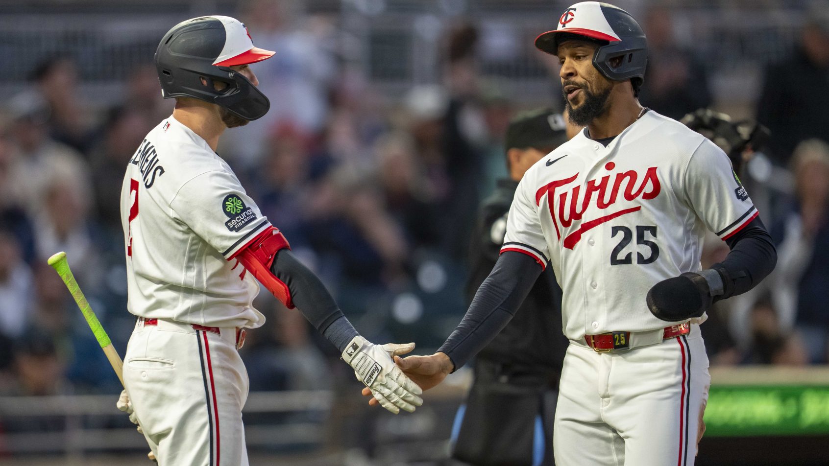 The Twins celebrate a run in a game versus the Astros.