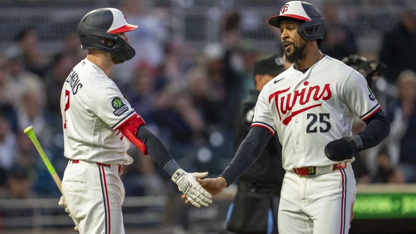 The Twins celebrate a run in a game versus the Astros.