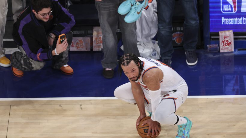 Jalen Brunson squatting with basketball