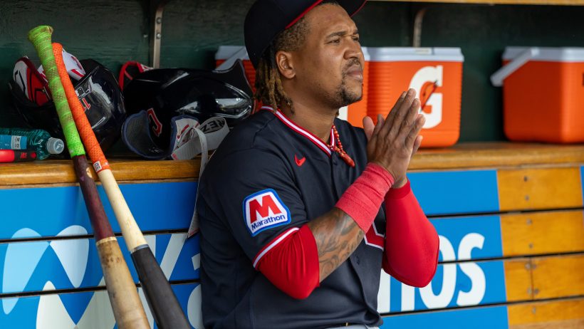 Jose Ramirez hands in prayer in dugout