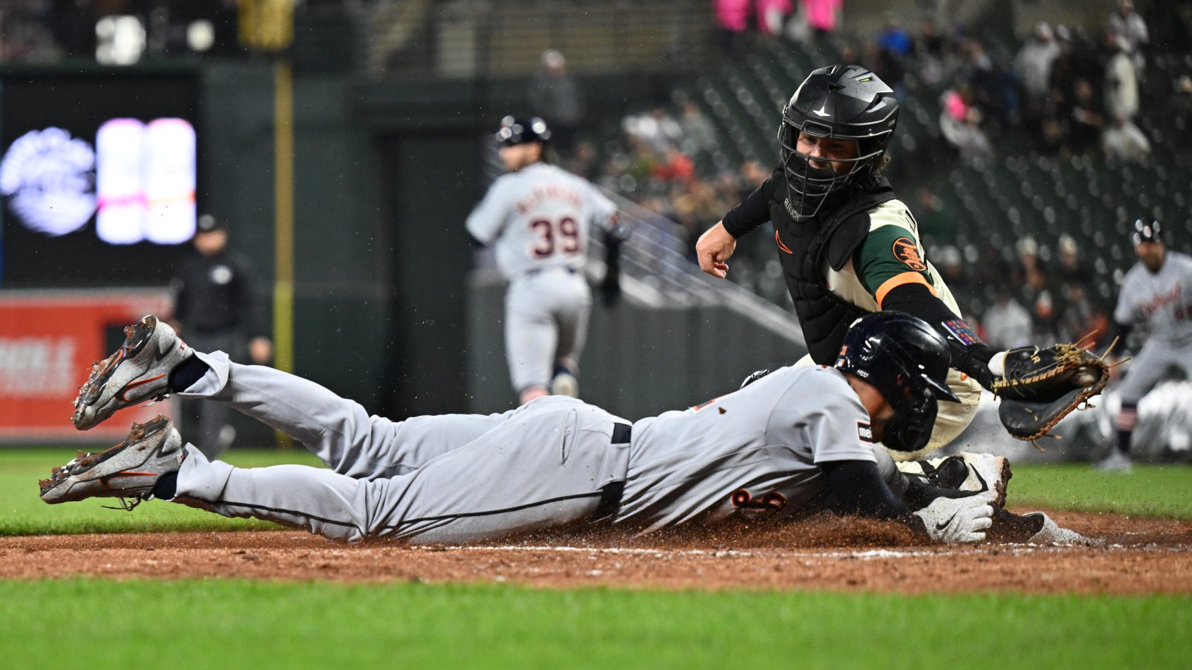 Riley Greene sliding into home plate