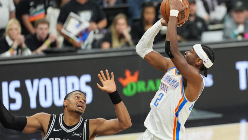 Oklahoma City Thunder guard Shai Gilgeous-Alexander shoots over San Antonio Spurs forward Keldon Johnson