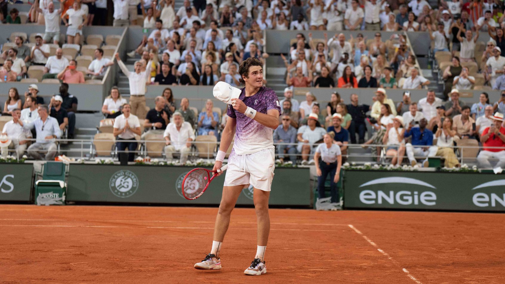 Joao Fonseca of Brazil celebrates winning his match against Novak Djokovic