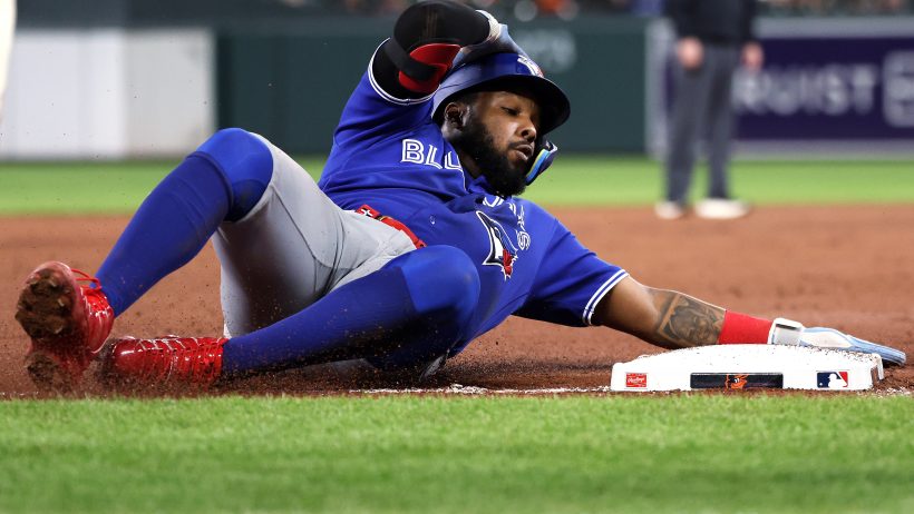 Vladimir Guerrero Jr. slides safely into third versus the Orioles.
