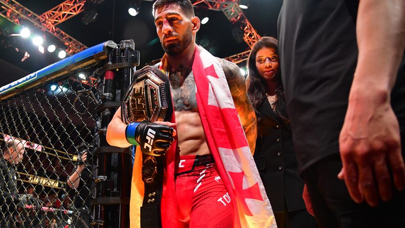 Ilia Topuria exits the UFC cage after a victory at UFC 298.