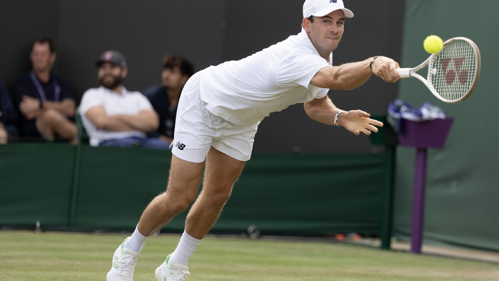 Tommy Paul of the United States stretching for a backhand