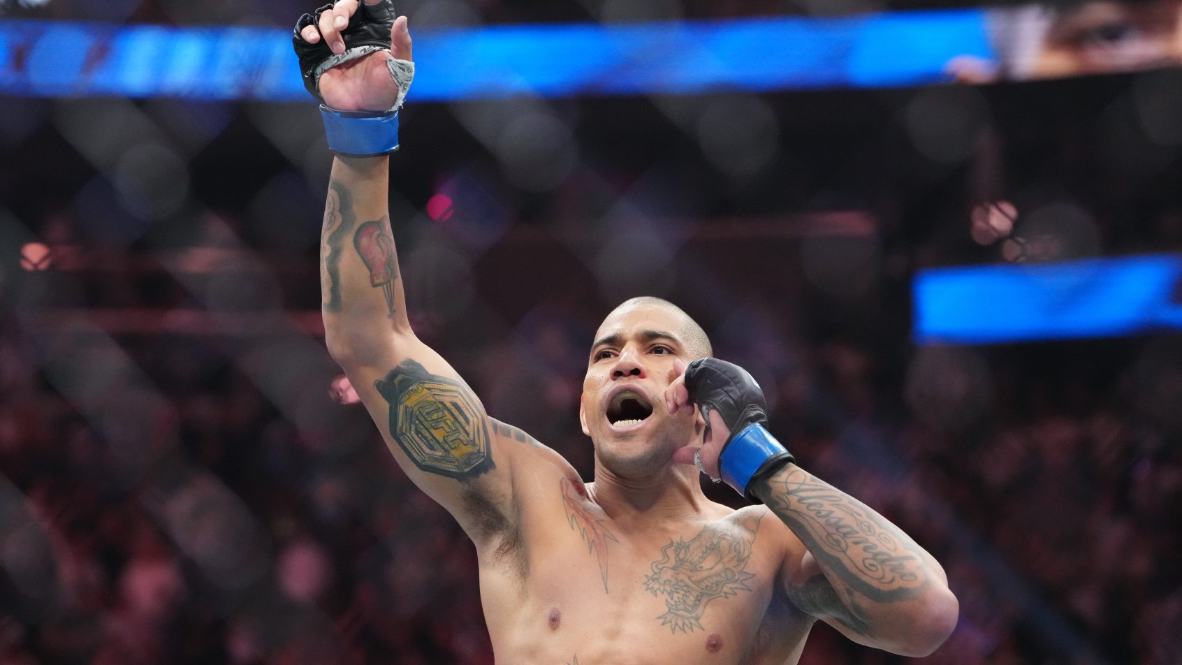 Oct 4, 2025; Las Vegas, Nevada, UNITED STATES; Alex Pereira (blue gloves) reacts after the fight against Magomed Ankalaev (red gloves) during UFC 320 at T-Mobile Arena. Mandatory Credit: Stephen R. Sylvanie-Imagn Images