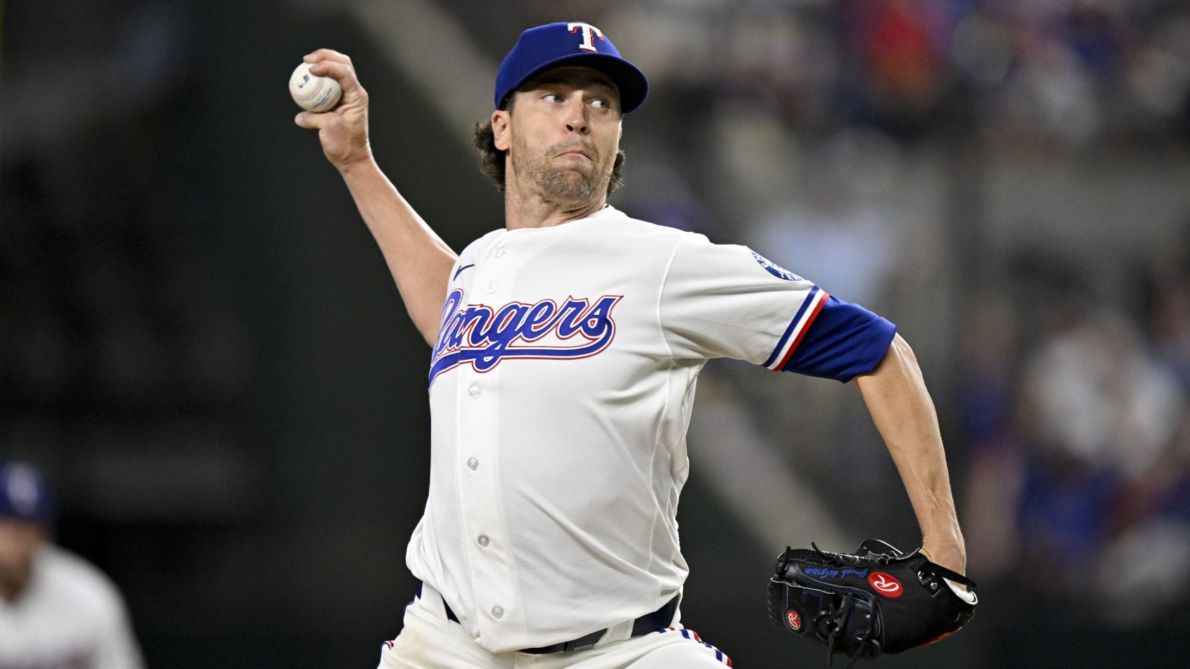 Jacob deGrom delivers a pitch versus the Astros.