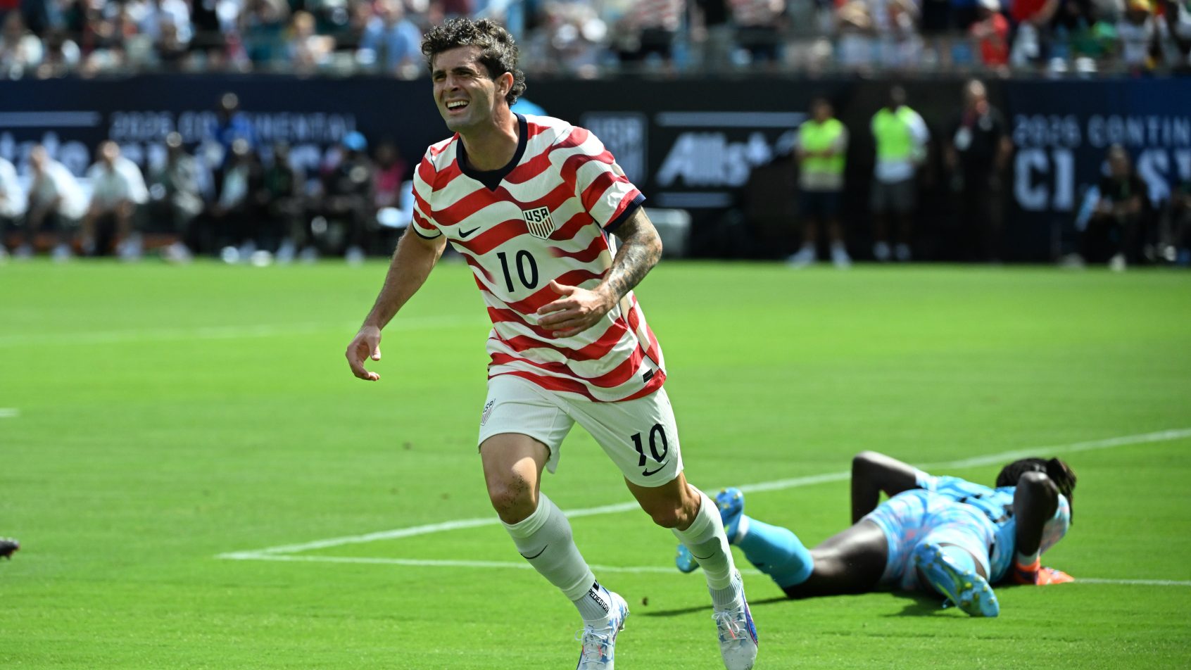 Christian Pulisic celebrating a goal with United States.