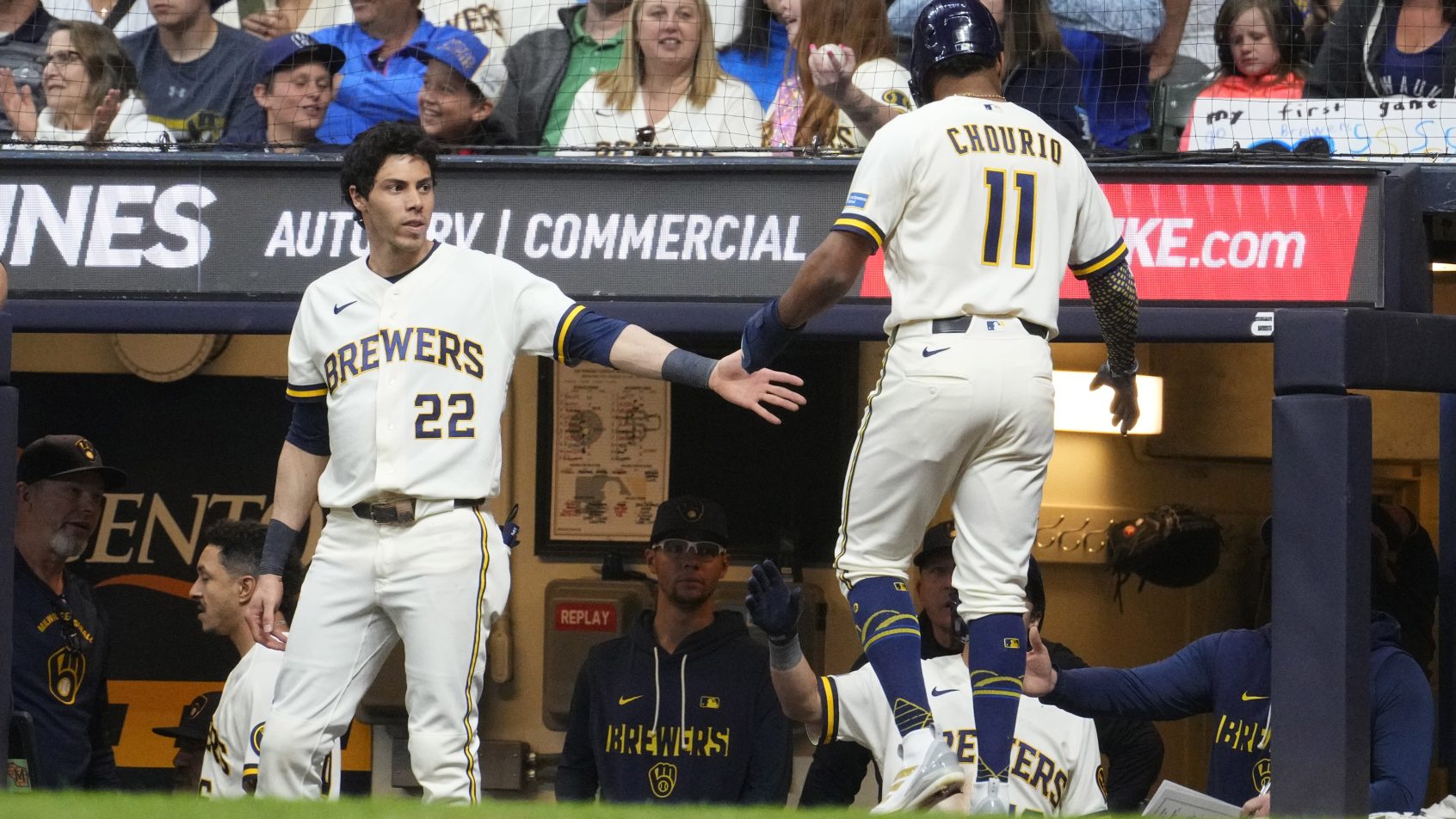 The Milwaukee Brewers celebrate after scoring on the San Francisco Giants during a 16-2 rout.