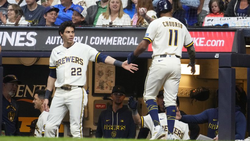 The Milwaukee Brewers celebrate after scoring on the San Francisco Giants during a 16-2 rout.
