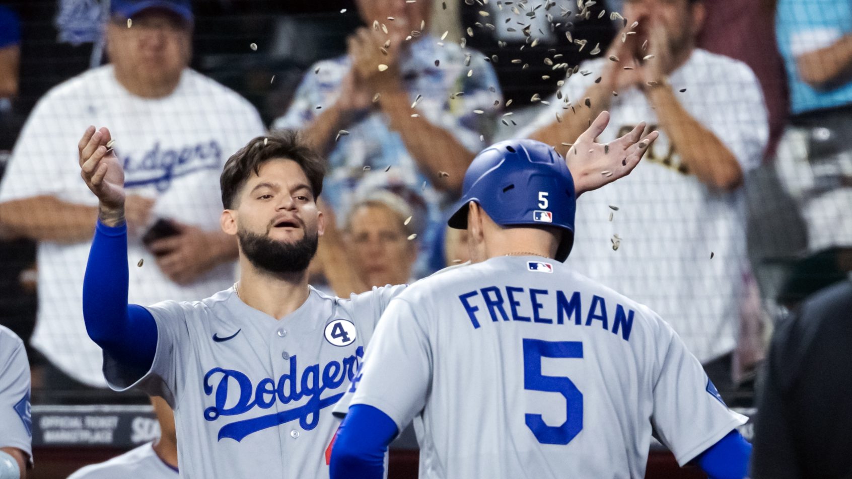Andy Pages celebrating with Freddie Freeman and the Los Angeles Dodgers