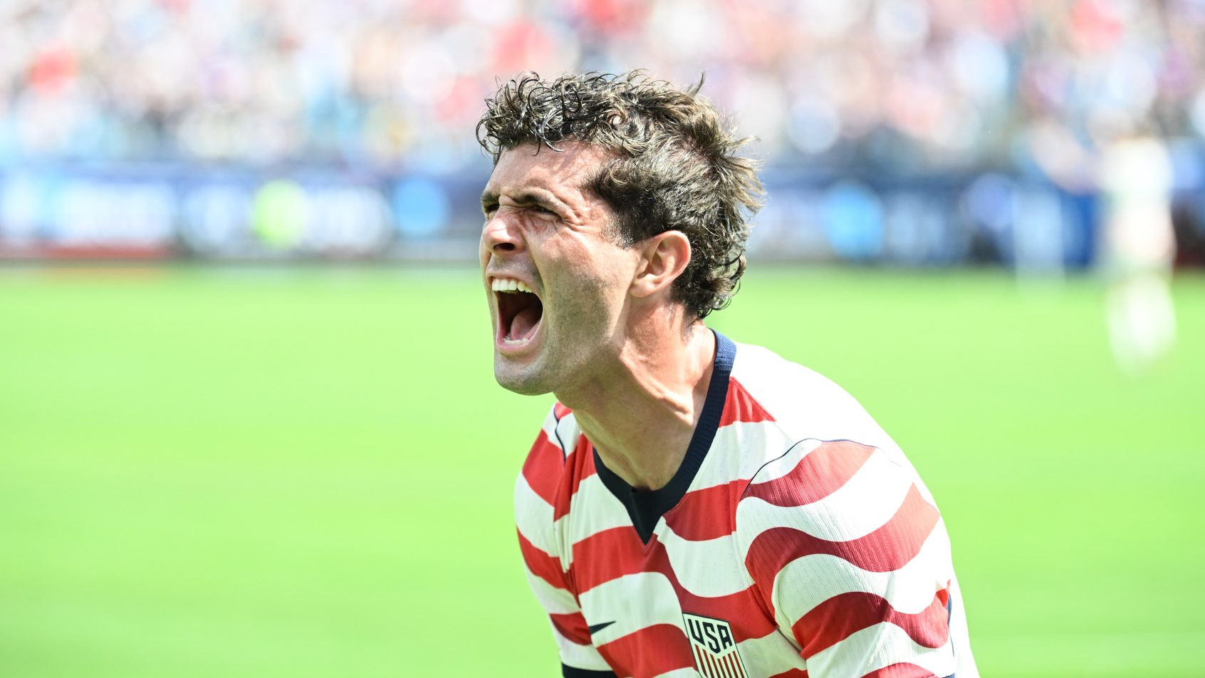 United States of America forward Christian Pulisic celebrating a goal