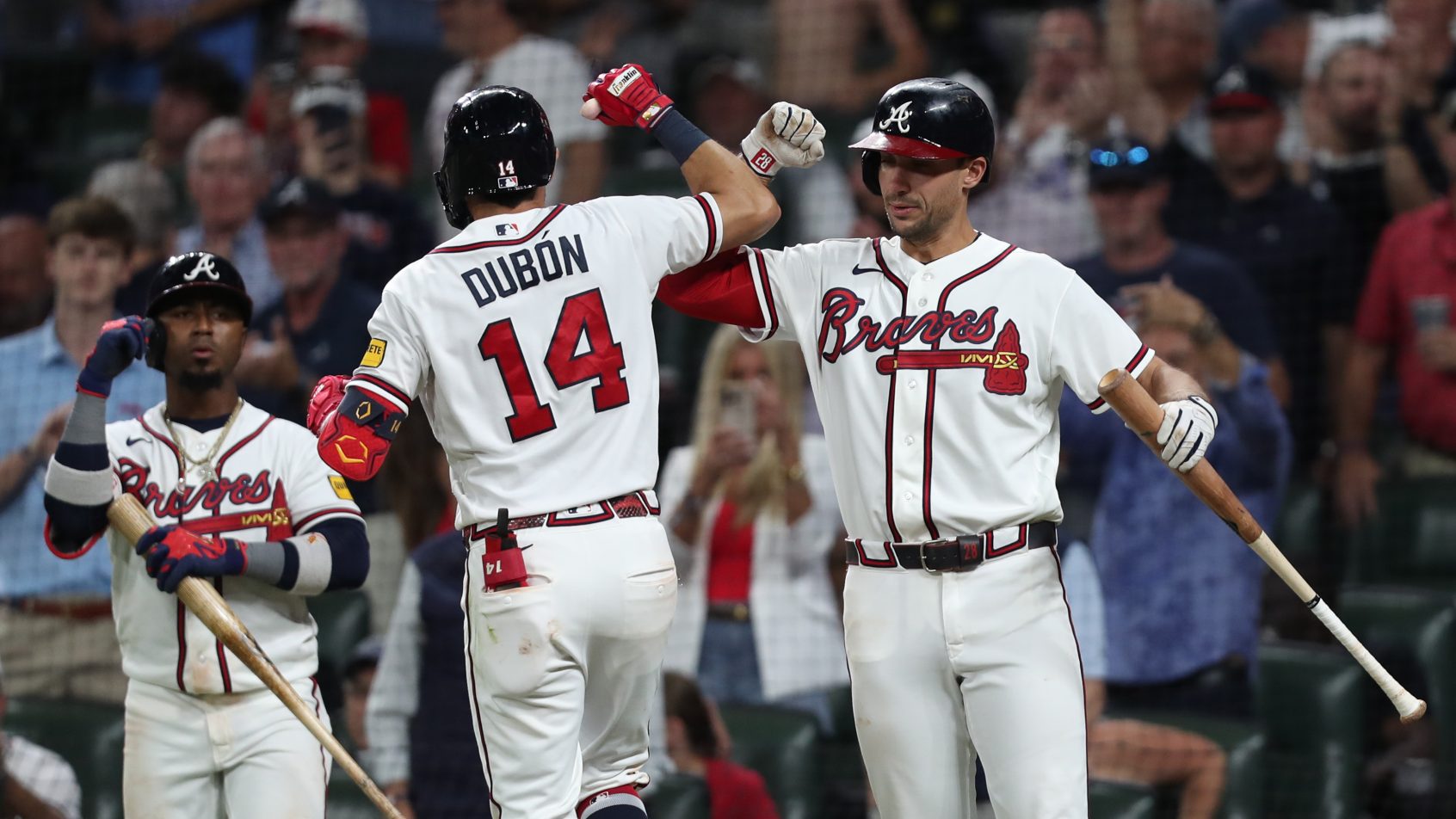 Matt Olson and Maurico Dubon celebrate at the Braves plate.