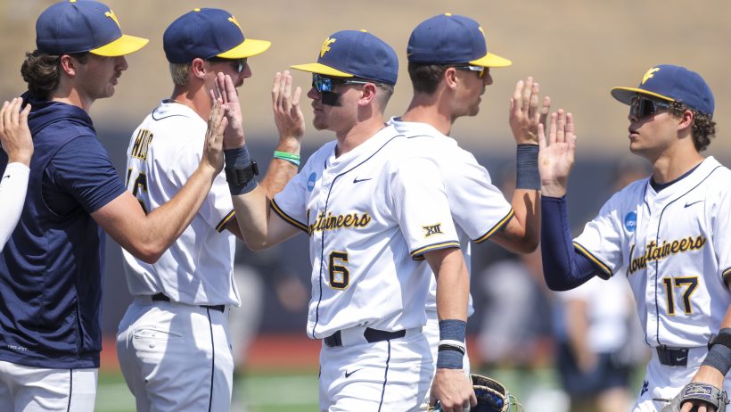 West Virginia celebrates a Super Regional win over Cal Poly.