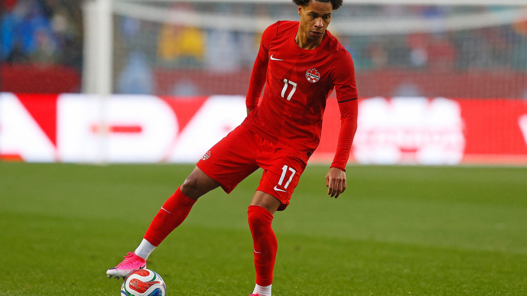 Team Canada midfielder Tajon Buchanan controls the ball