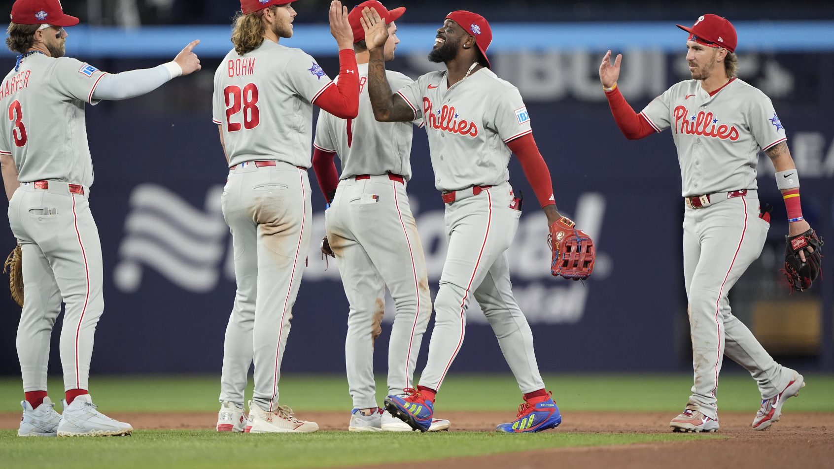 The Phillies celebrate a victory over the Blue Jays.
