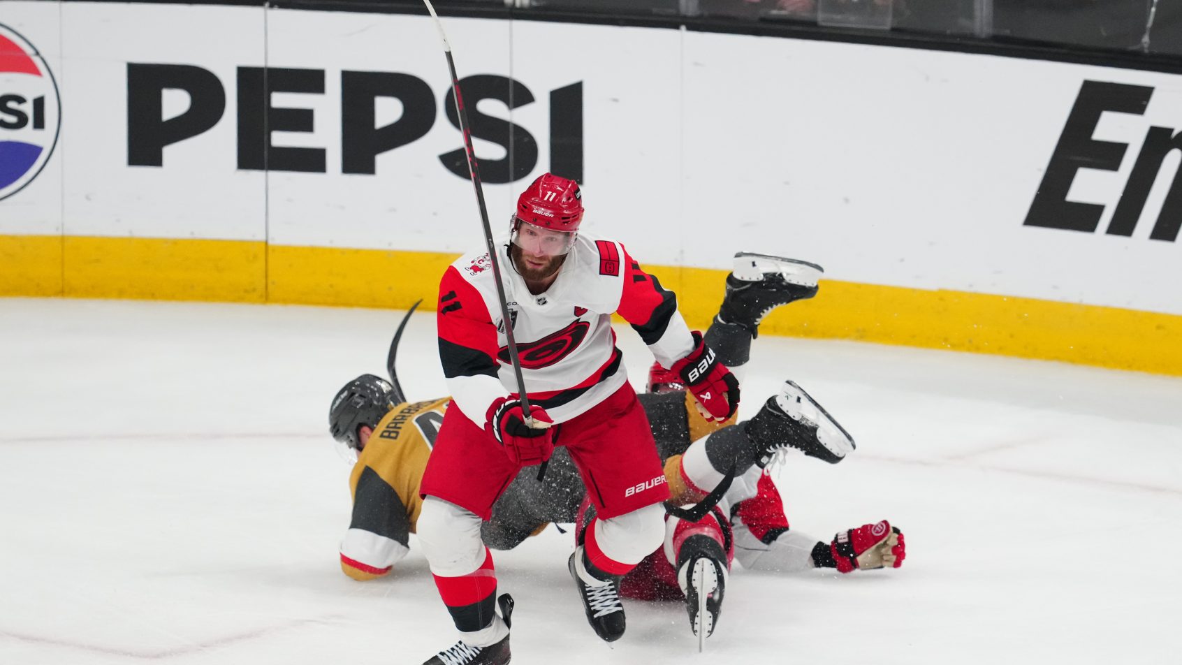 Jordan Staal skates up ice after a collision in the Hurricanes zone.