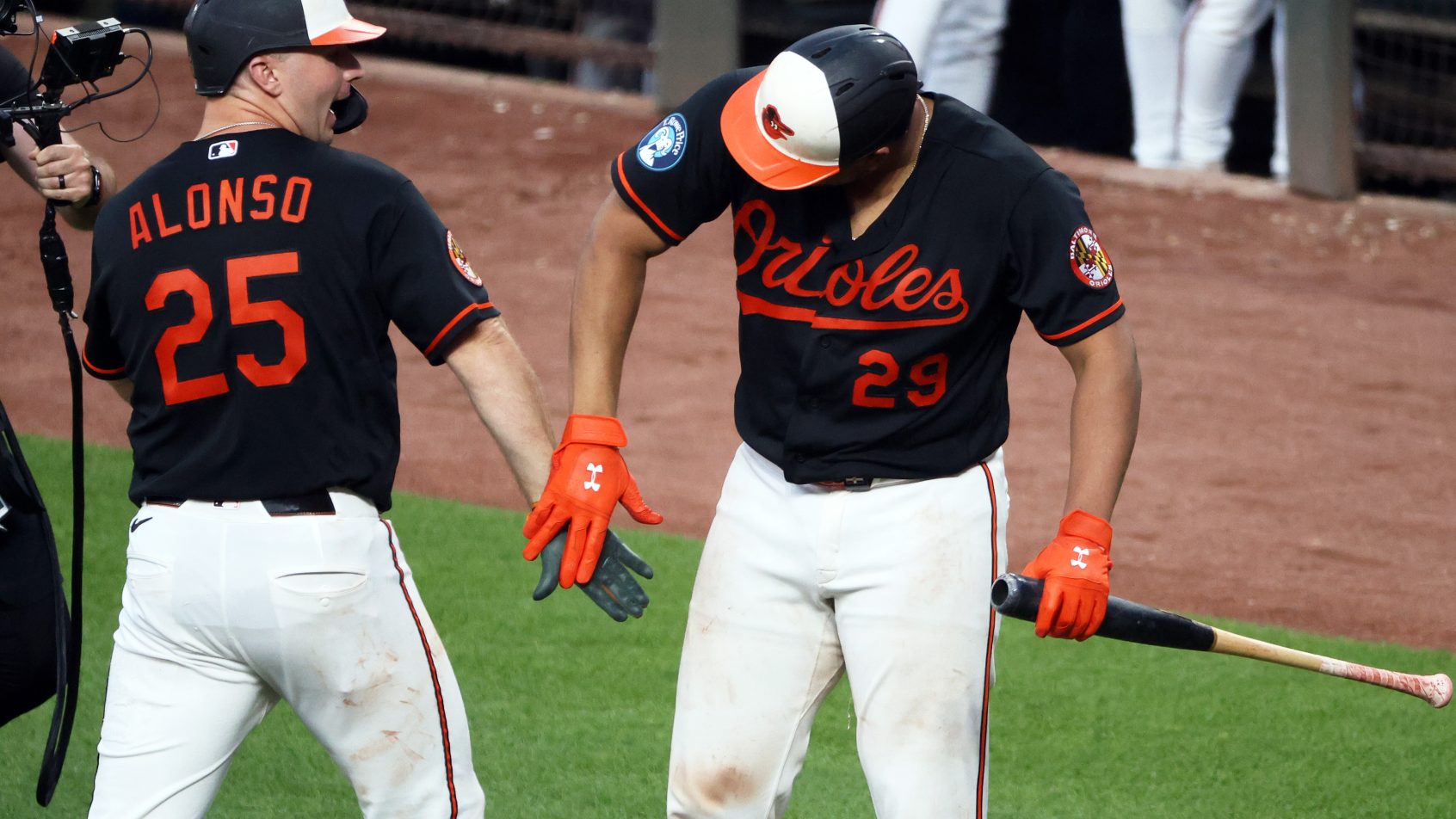The Orioles celebrate a home run in a victory over the Mariners.