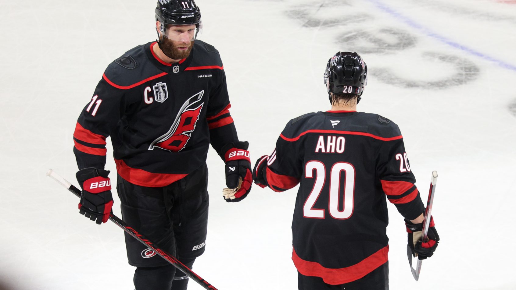 Carolina Hurricanes center Jordan Staal celebrates with center Sebastian Aho