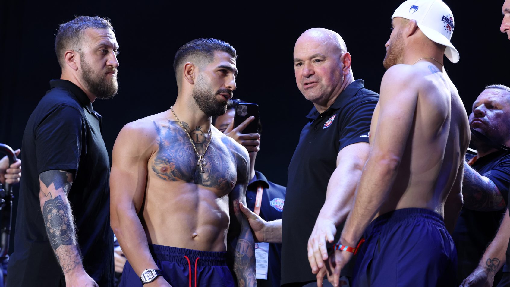 Jun 13, 2026; Washington, D.C., USA; Dana White (center) separates Ilia Topuria (left) and Justin Gaethje during weigh-ins for the UFC Freedom 250 at The Ellipse. Mandatory Credit: Amber Searls-Imagn Images