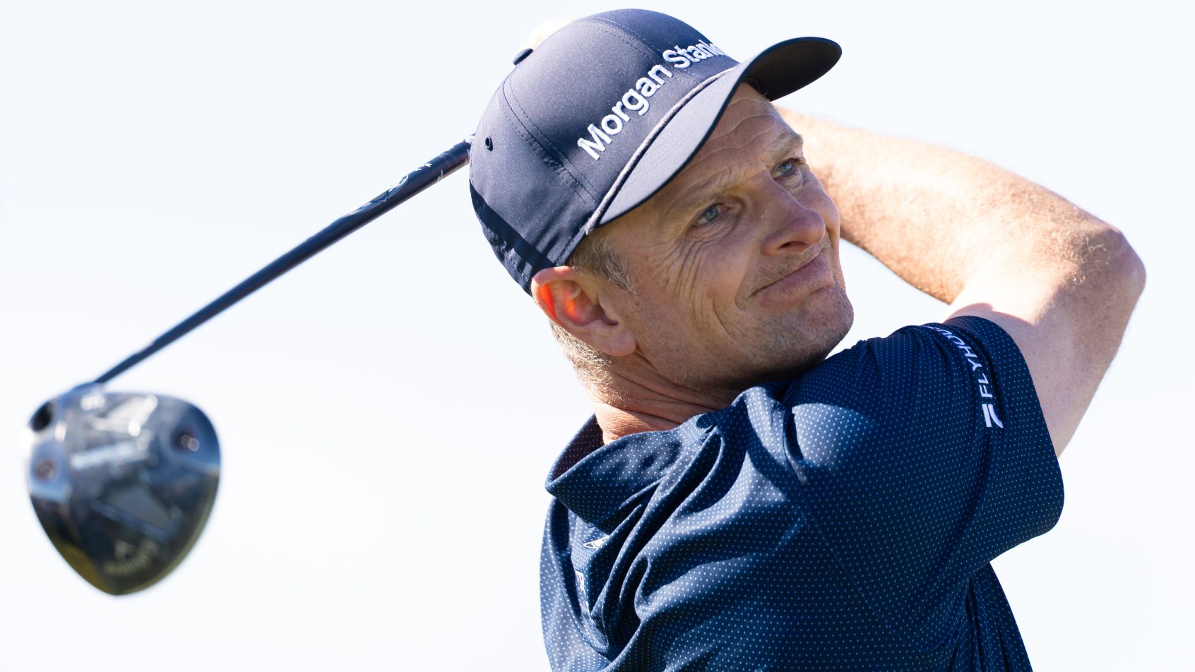 Justin Rose sweats a tee shot during a practice round at the US Open.