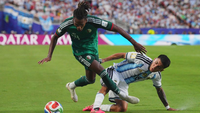 Algeria's Hicham Boudaoui battling for the ball