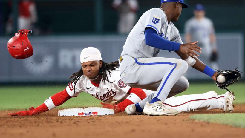 CJ Abrams slides into second base in a game versus the Royals.