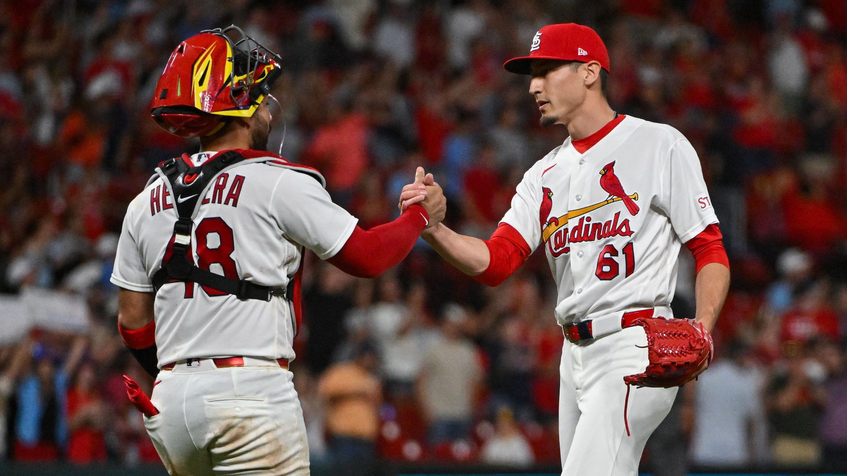 Ivan Herrera and Riley O'Brien celebrating for the St. Louis Cardinals.