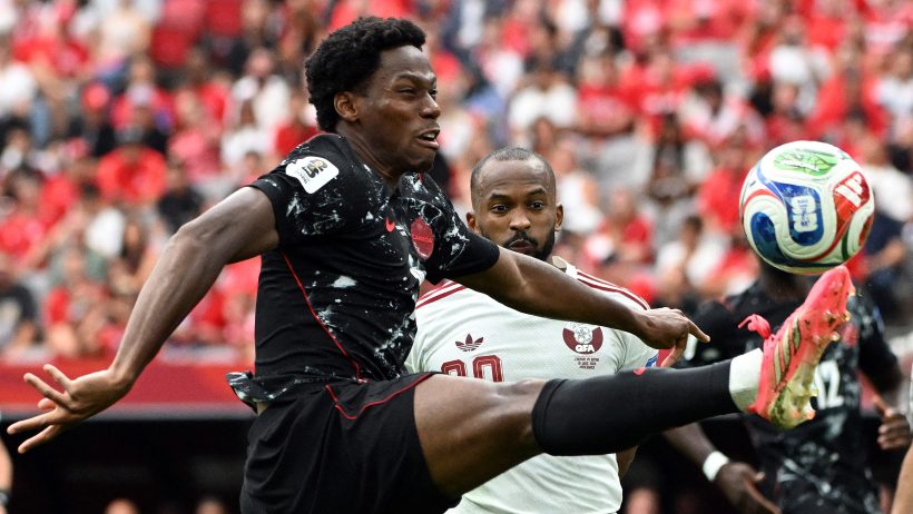Canada's Jonathan David brings the ball down with his right foot