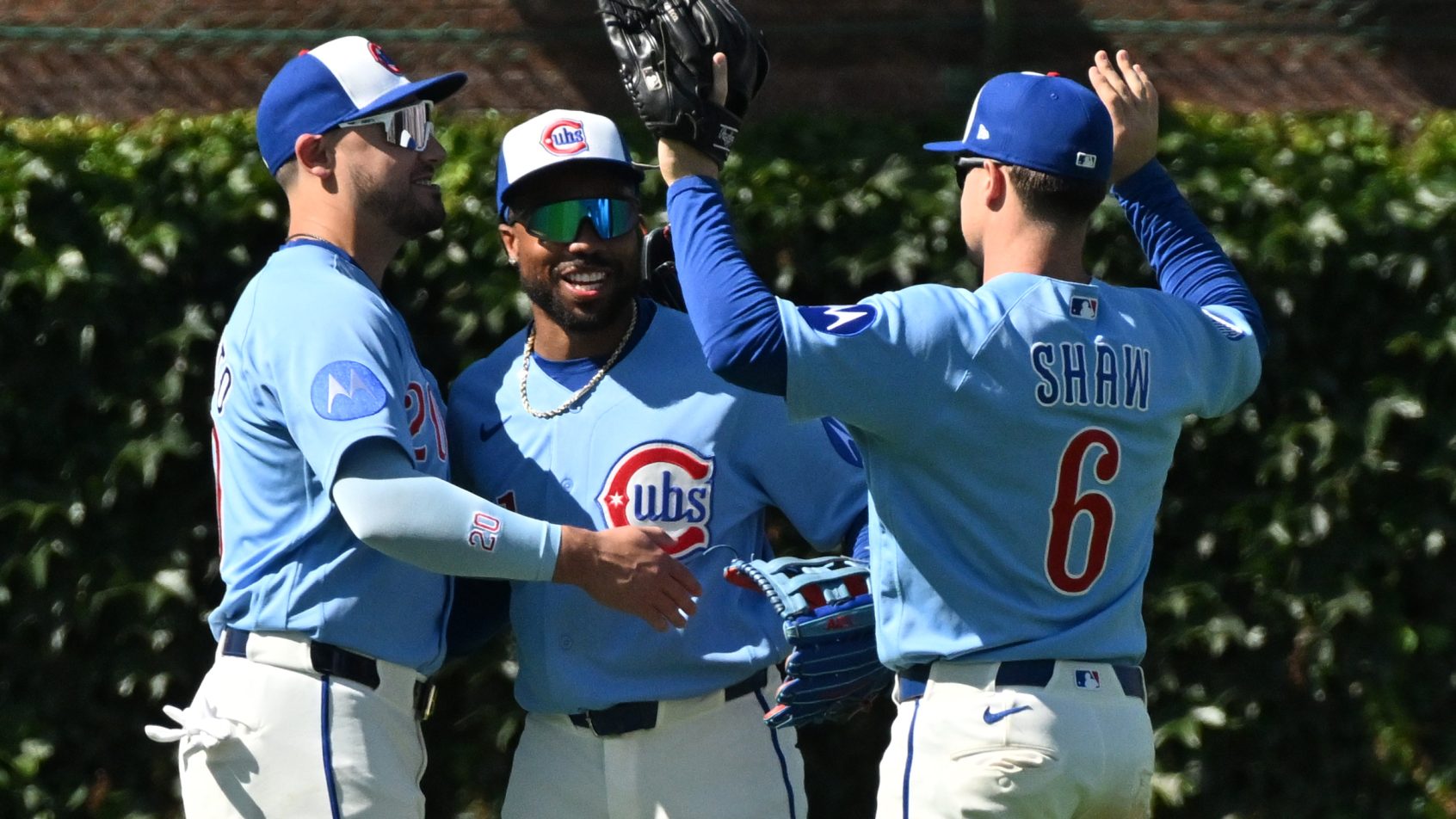 The Cubs celebrate a lopsided win over the Blue Jays.