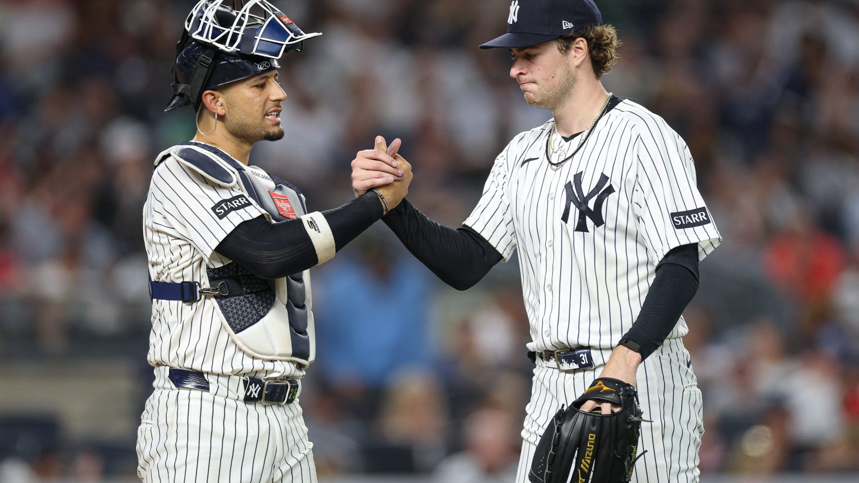 Cam Schlittler shaking hands with catcher