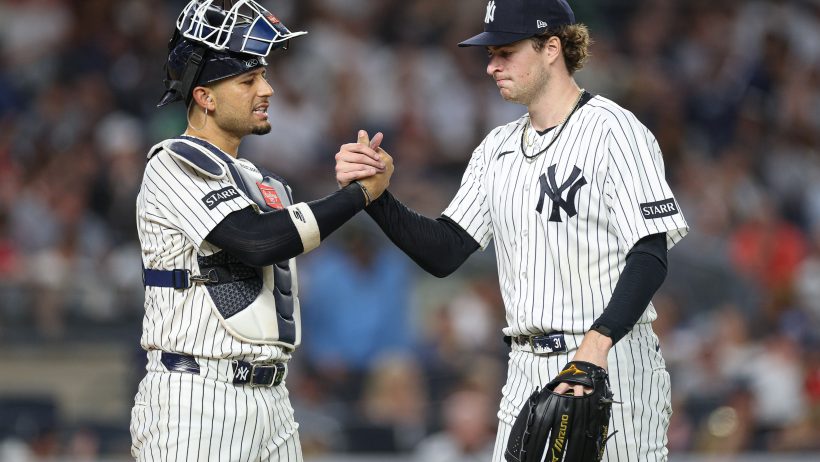 Cam Schlittler shaking hands with catcher