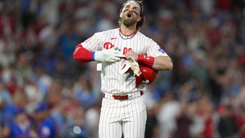 Bryce Harper celebrates after hitting a triple in a rout of the Mets.