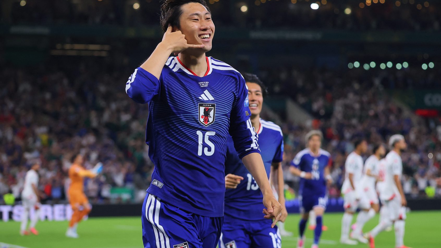 Daichi Kamada celebrating a goal with Japan in the 2026 FIFA World Cup.