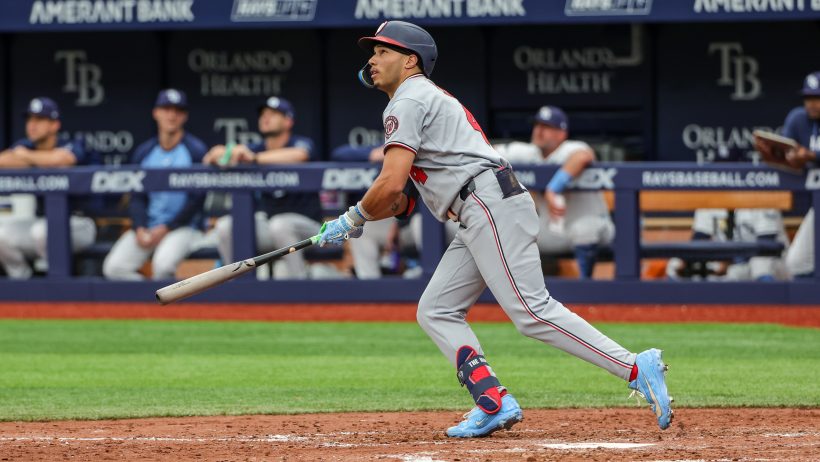 Daylen Lile lifts a fly ball to the outfield in a matchup versus the Rays.
