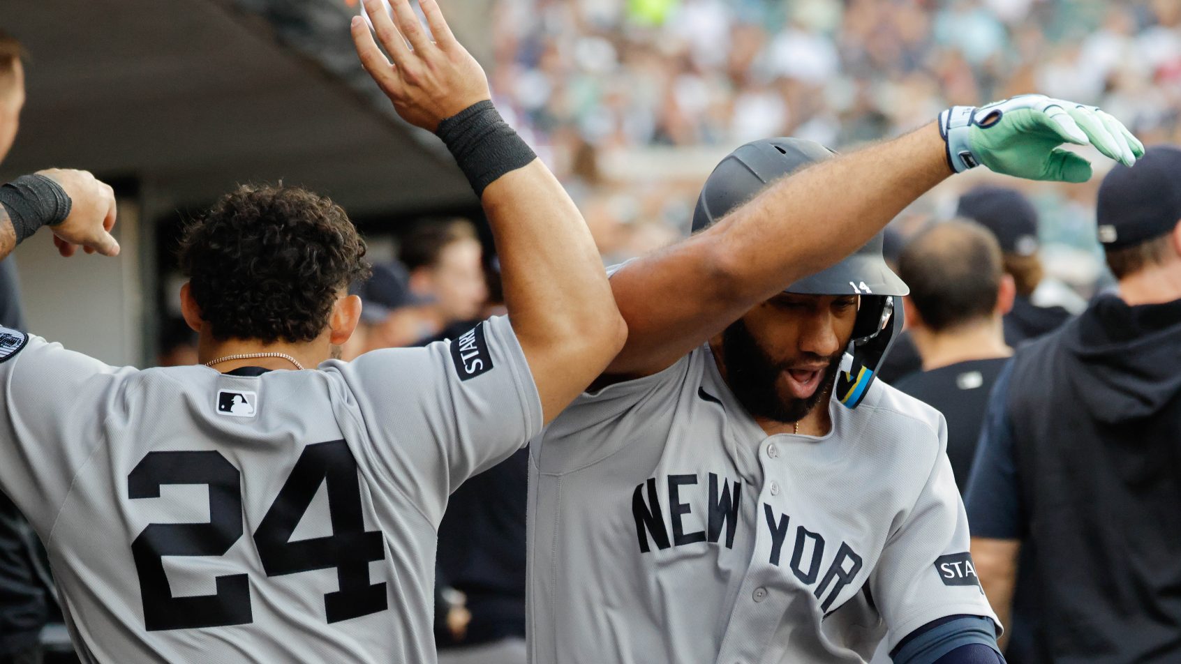 The Yankees celebrate in the dugout following a Ahmed Rosario home run.