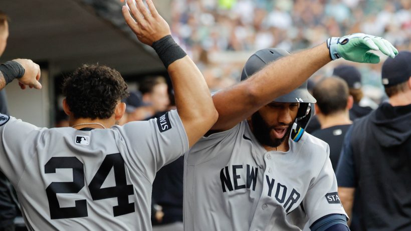 The Yankees celebrate in the dugout following a Ahmed Rosario home run.