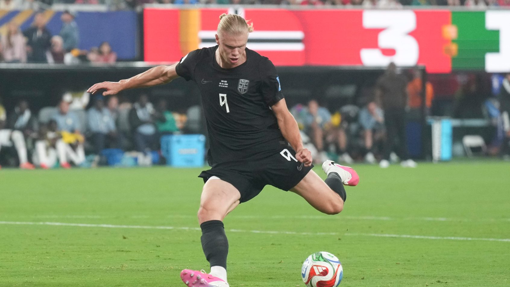 Haaland drills a shot during a World Cup match vs Senegal.