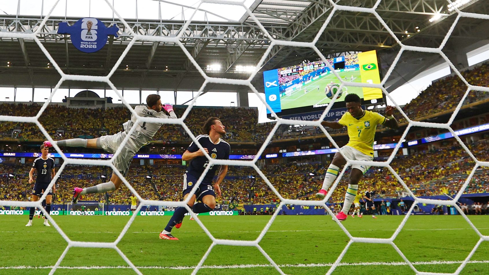 Brazil's Vinicius Junior scoring on a header vs Scotland