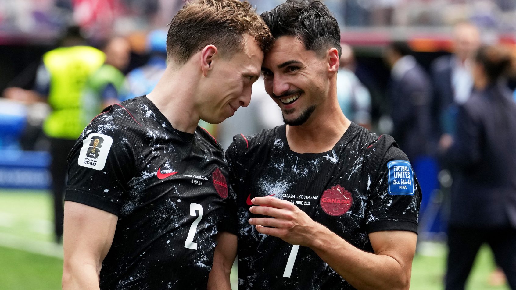 Canada's Stephen Eustaquio and Alistair Johnston celebrate after the match