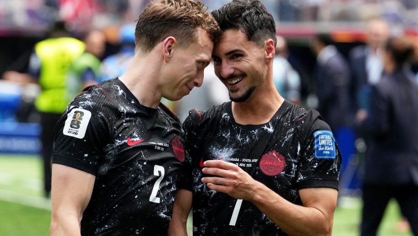 Canada's Stephen Eustaquio and Alistair Johnston celebrate after the match