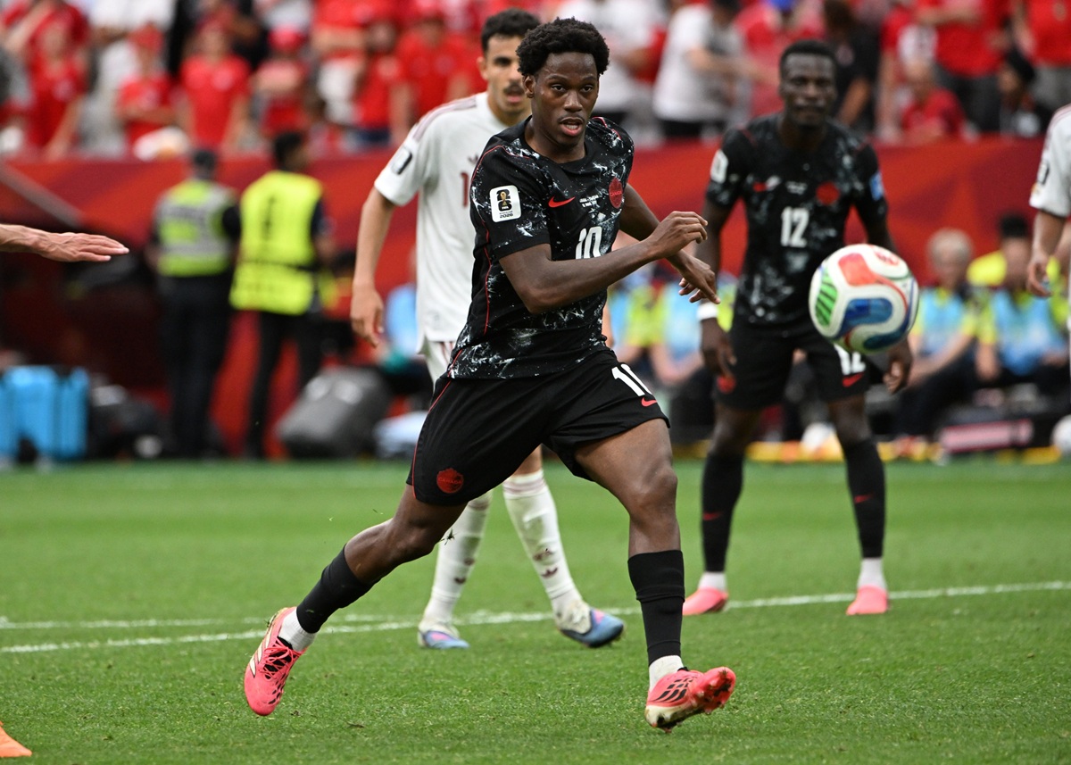 bet99 promo code SBD. Jonathan David dribbles for Canada.