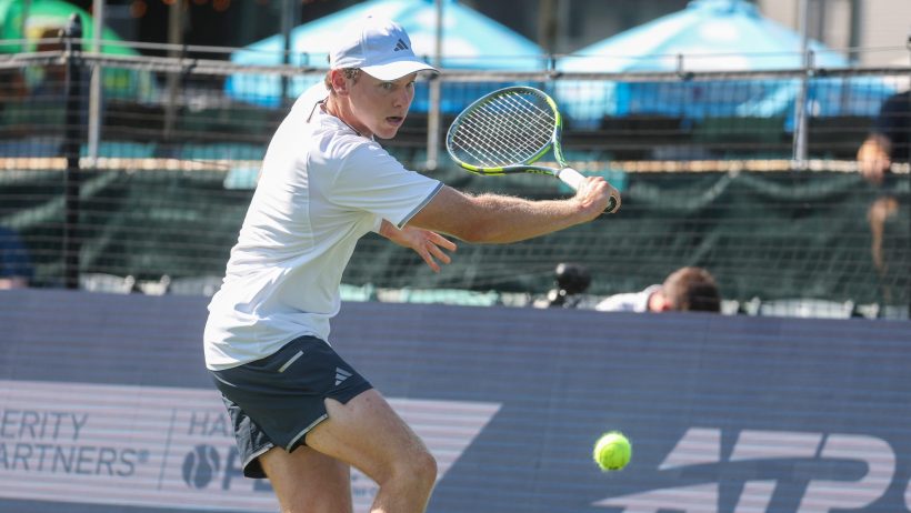Alex Michelsen hitting a backhand slice