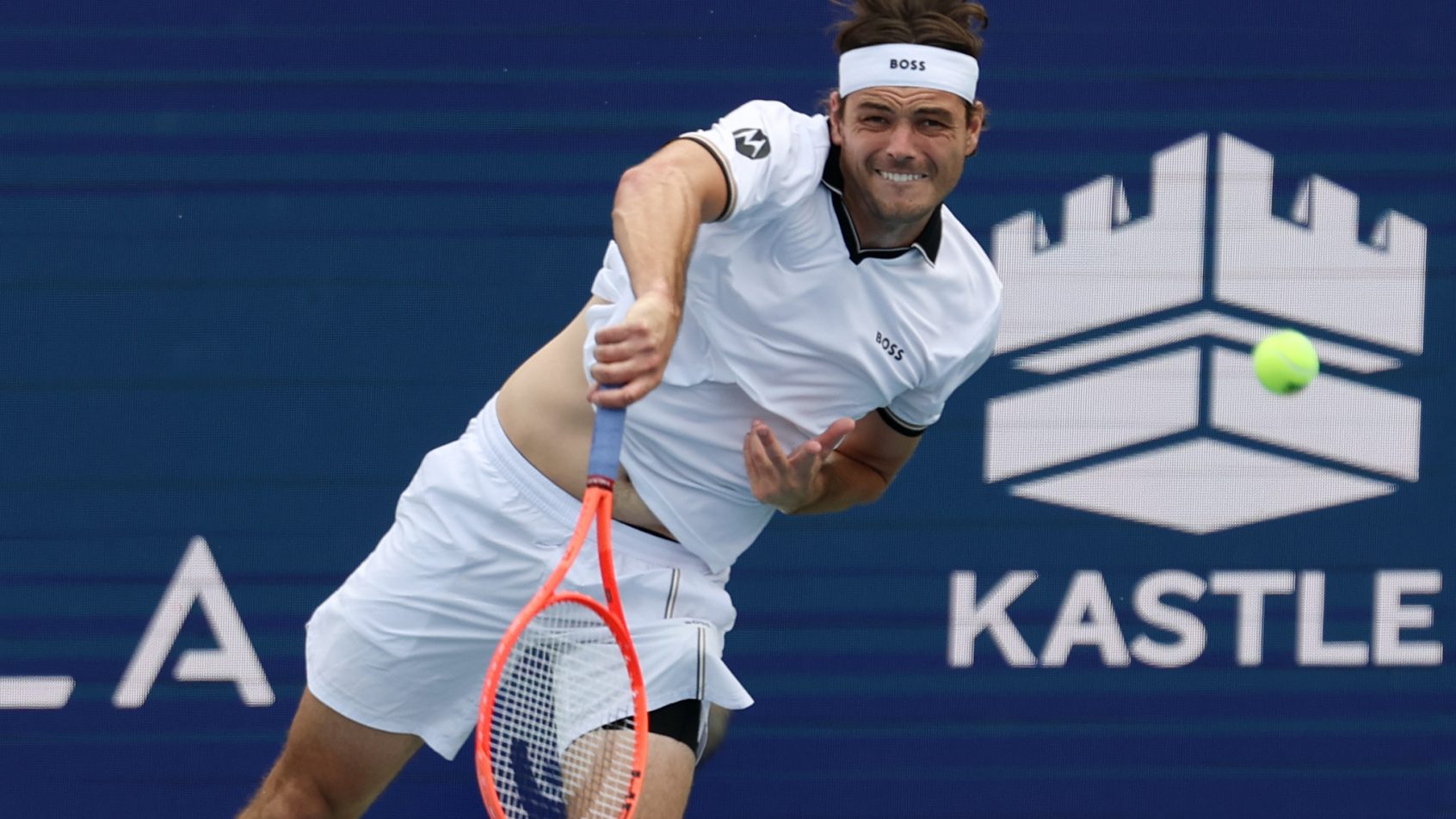Taylor Fritz hitting a serve