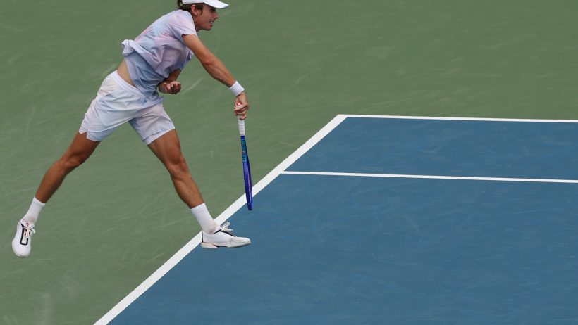 Alex de Minaur hitting a serve